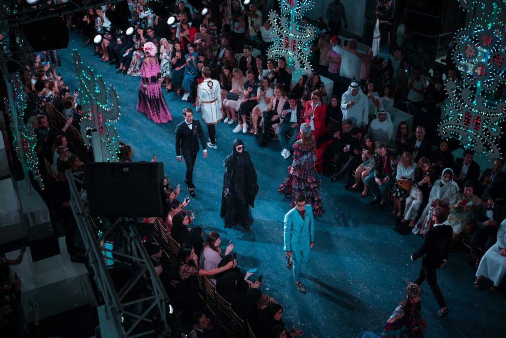 people fashion show on stage in dubai