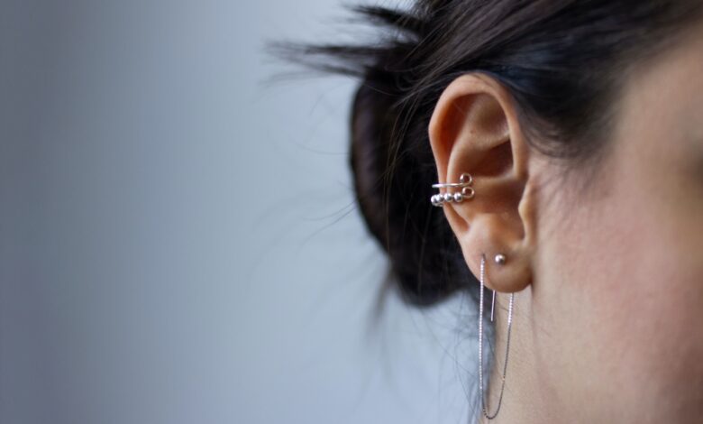 silver-colored earrings