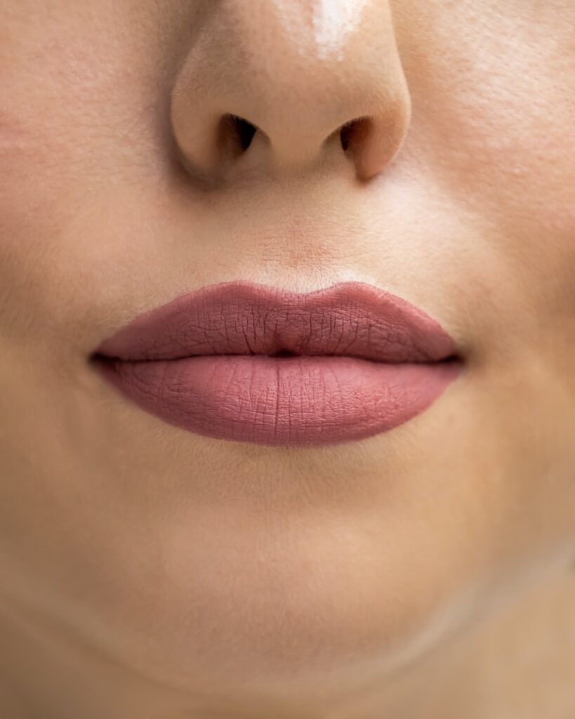 a close up of a woman's lips and nose