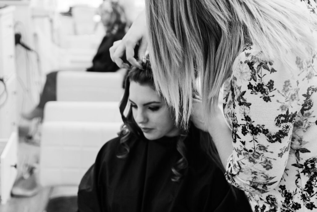 grayscale photography of woman getting her hair done inside salon, Hair Styling in Dubai